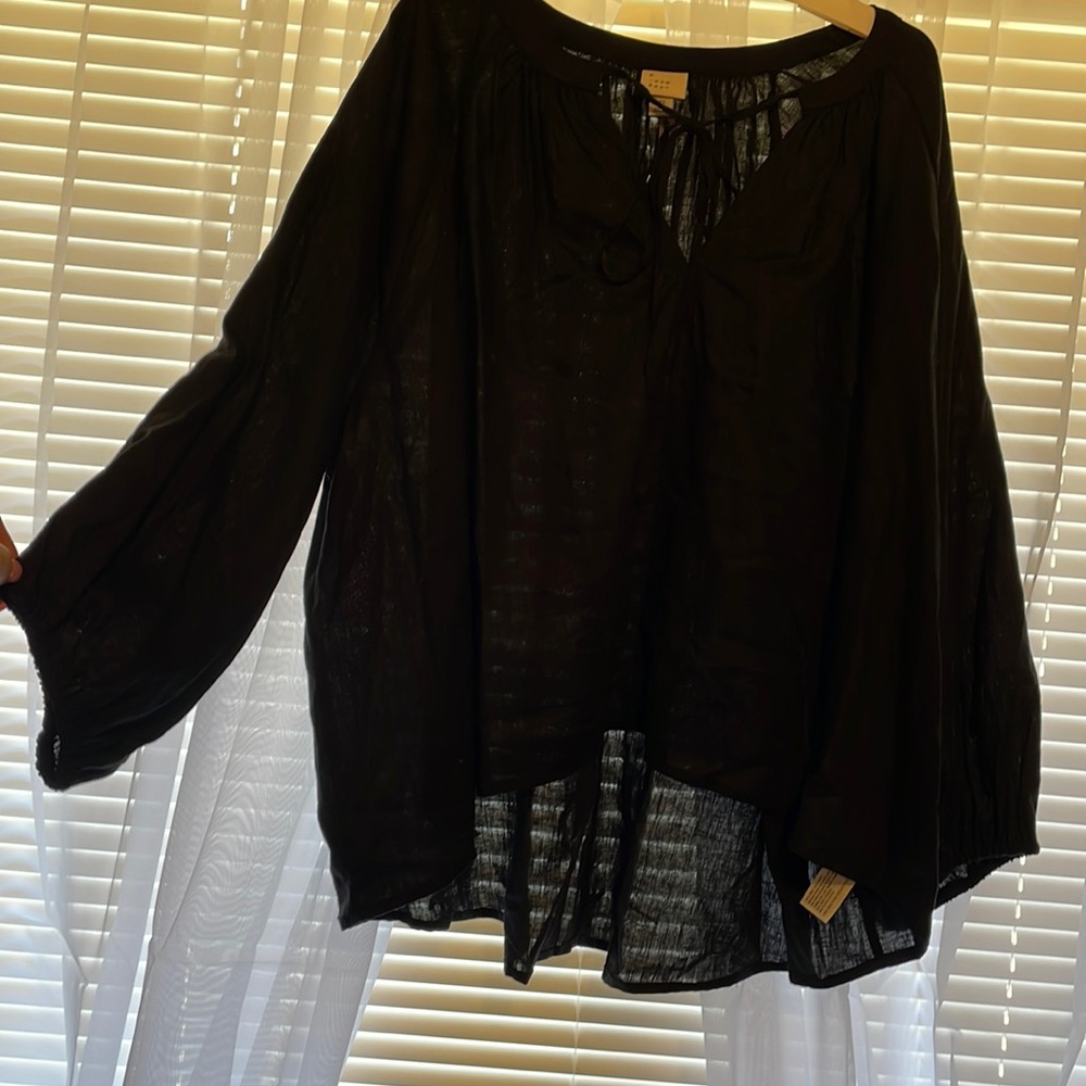 A new day long sleeve top. Size extra large.